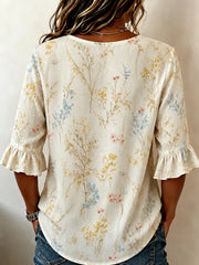 Off White Wild Floral V Neck Three Wooden Button Ruffle Half Sleeve Loose Blouse With Side Pockets