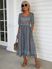 Dark Base Multicolor Floral Print V Neck Half Sleeve Smocked Waist Midi Tunic Dress With Pockets